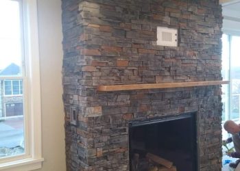 Rustic stone fireplace for cozy interiors in St. Anthony